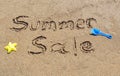 Summer sale written in the sand Royalty Free Stock Photo